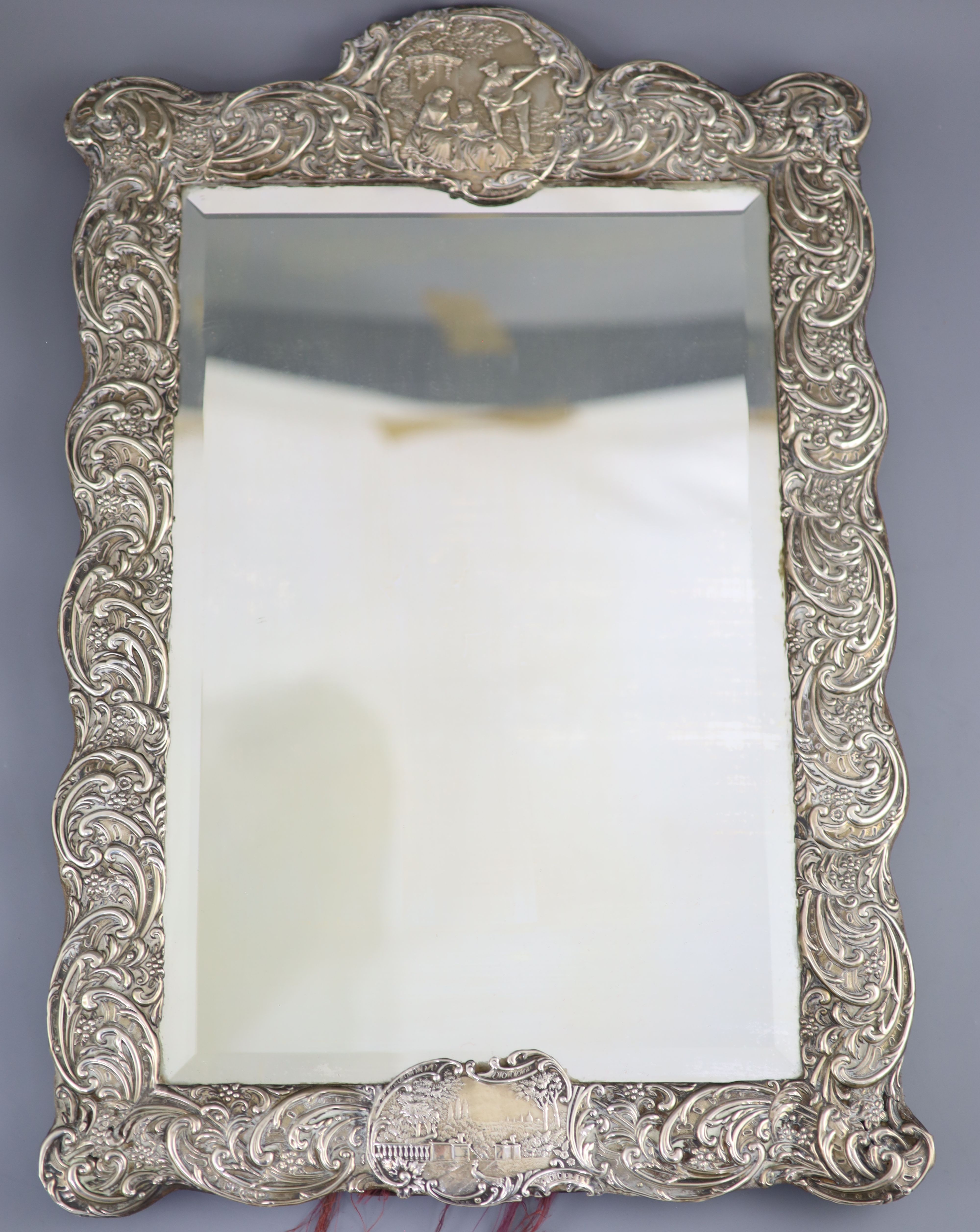 An Edwardian repousse silver mounted toilet mirror, Henry Matthews, Birmingham, circa, 1905,
